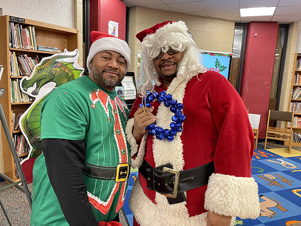 Officers David Hammond and Alfonso Roberts brought the holiday spirit dressed as Santa and his elf