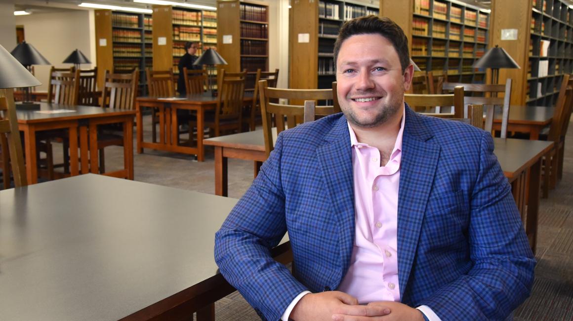 Dayen Wilson sitting in the law library