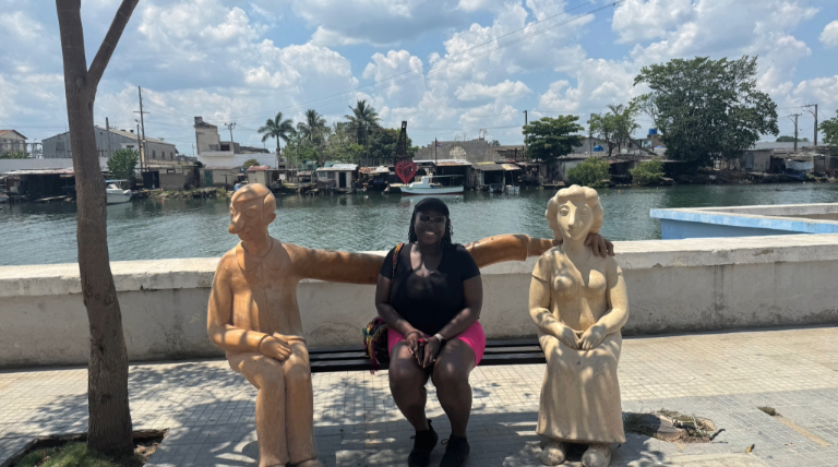 Lee Battle sitting on a bench in Matanzas