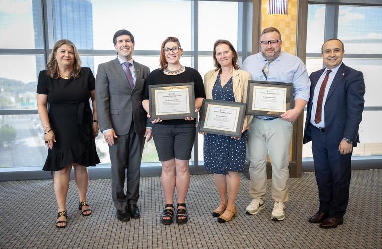 Faculty posing with their creative teaching awards.