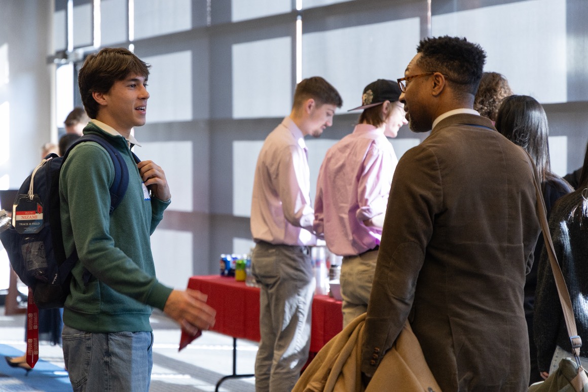 attendees chat during the ice cream social and networking portion of Hacking4Humanity 2026
