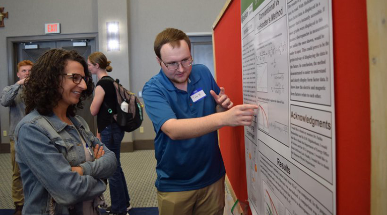 Duquesne student Tyler Williams presenting at the Undergraduate Research Symposium.