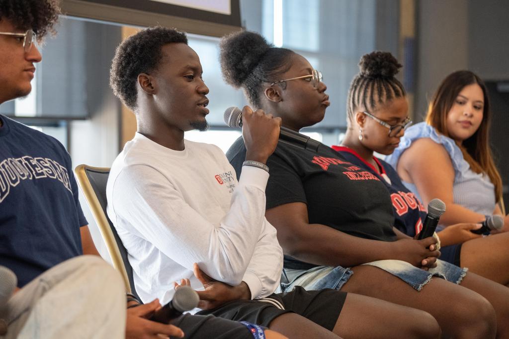 Students on a panel.