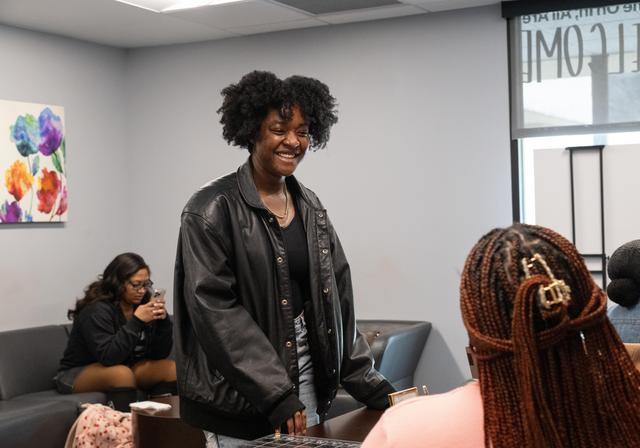 Student Nialah Miller talking with Venetia Khouri at The Center.