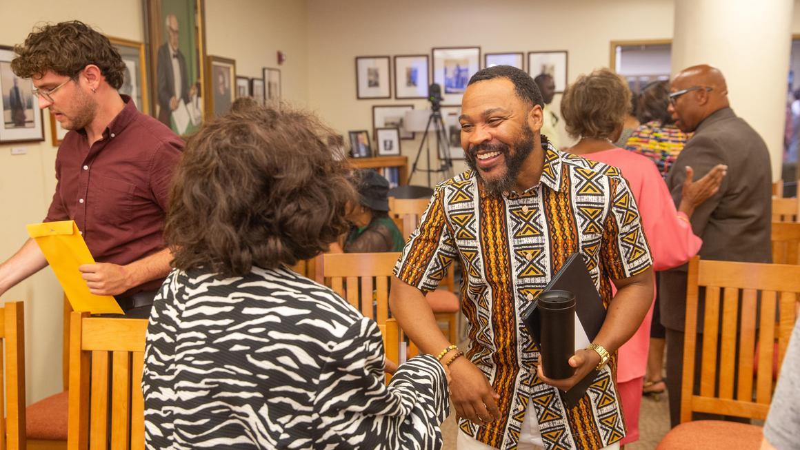 Quincy Stephenson greeting an attendee at Juneteenth 2026.