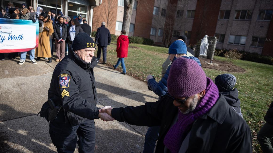 DU Police offer Frank Cortazzo greeting MLK Unity Walk 2026 participants