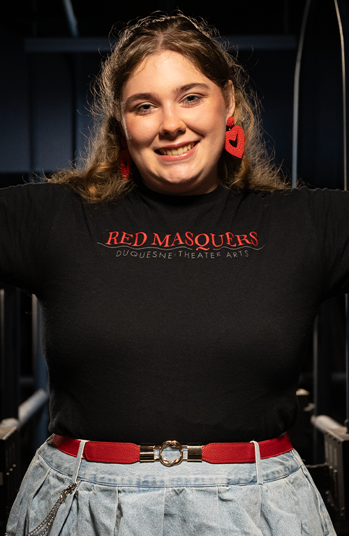 Rachel Lewandowski on the skywalk above the Genesius Theater's stage.